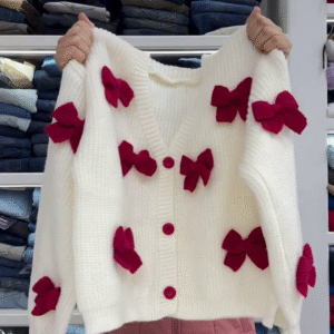 Cozy White Knit Cardigan with Playful Red Bow Accents